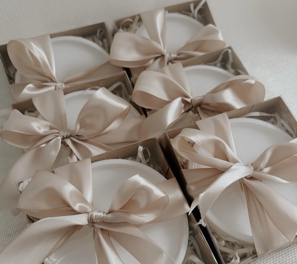 Boxed coasters tied with champagne satin ribbons